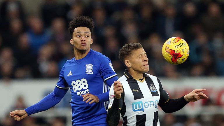 Birmingham City's Josh Dacres-Cogley (left) battles for the ball with Newcastle United's Dwight Gayle
