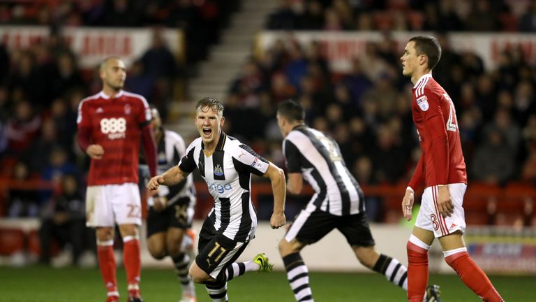 Newcastle United's Matt Ritchie celebrates scoring his side's first goal of the game during the Sky Bet Championship match at the City Ground, Nottingham.