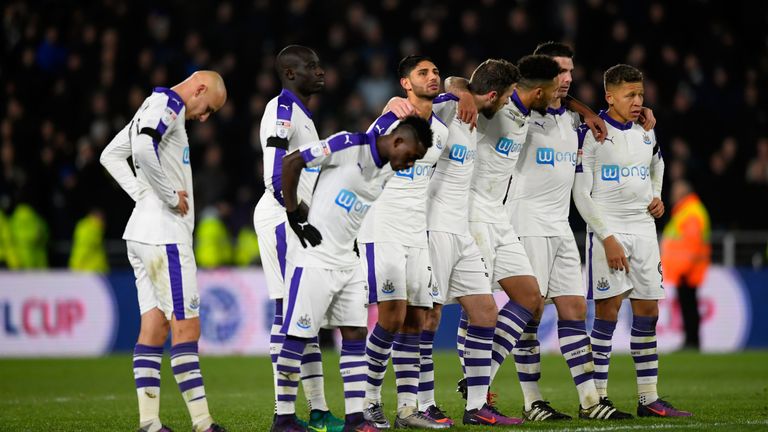 Newcastle players watch on during the penalty shootout against Hull City