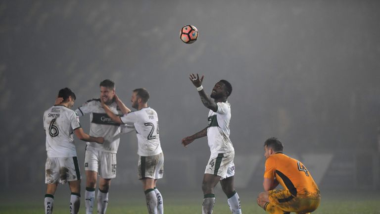 NEWPORT, WALES - DECEMBER 21:  Yann Songo'o (r) and team mates celebrate after winning in extra time during The Emirates FA Cup Second Round Replay between