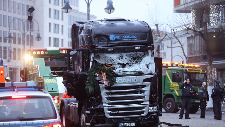 The cab of a lorry is seen on a Berlin street the morning after it ploughed through a Christmas market