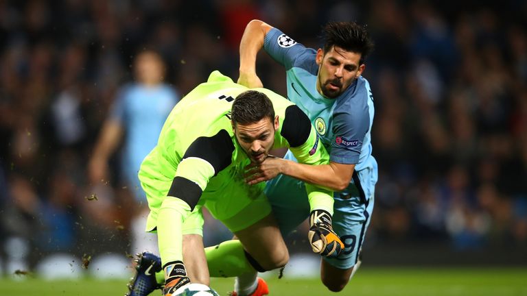 Craig Gordon of Celtic (L) and Nolito of Manchester City (R) both challenge for the ball