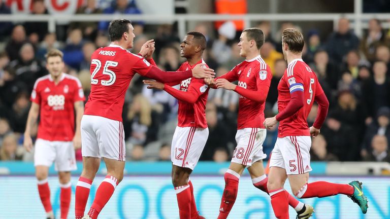 Nottingham Forest's Nicolao Dumitru (centre) celebrates scoring his sides opening goal during the Sky Bet Championship match at St James' Park, Newcastle.