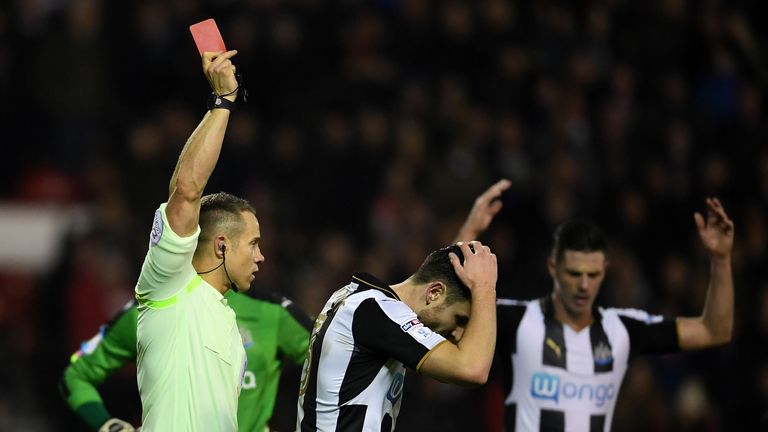 NOTTINGHAM, ENGLAND - DECEMBER 02: Referee Stephen Martin shows a red card to Paul Dummett of Newcastle United during the Sky Bet Championship match betwee