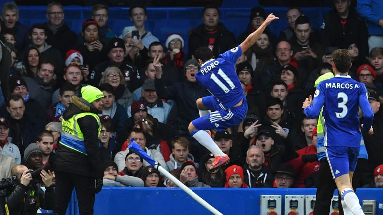 Chelsea's Spanish midfielder Pedro (C) celebrates scoring the opening goal during the English Premier League football match between Chelsea and Bournemouth