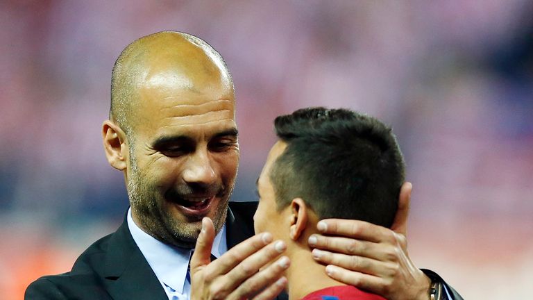 MADRID, SPAIN - MAY 25:  Head coach Pepe Guardiola (L) of Barcelona embraces Alexis Sanchez after their victory in the Copa del Rey Final match between Ath