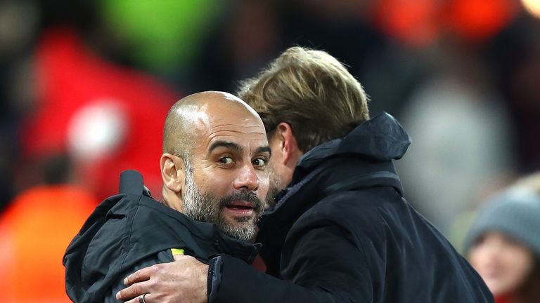 LIVERPOOL, ENGLAND - DECEMBER 31:  Jurgen Klopp, Manager of Liverpool and Josep Guardiola, Manager of Manchester City hug during the Premier League match b