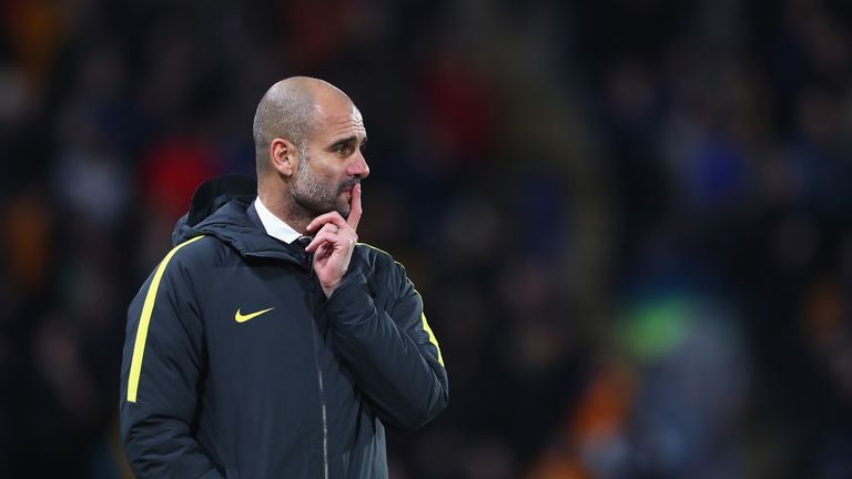 Pep Guardiola looks on from the touchline at the KCOM Stadium