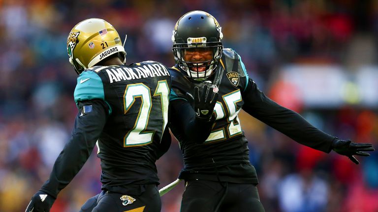 Peyton Thompson celebrates victory with team-mate  Prince Amukamara after the NFL International series game  in London