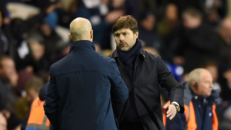LONDON, ENGLAND - DECEMBER 03:  Mauricio Pochettino, Manager of Tottenham Hotspur and Bob Bradley, Manager of Swansea City shake hands at the end of the ga