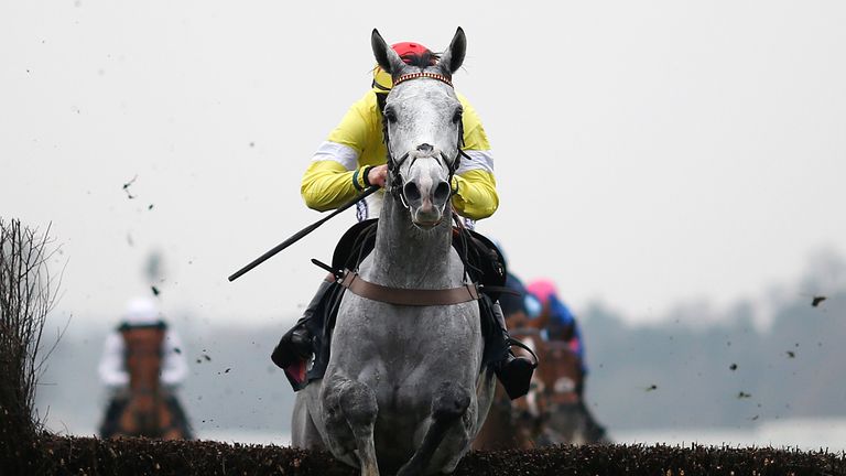 Sam Twiston-Davies and Politologue clear the last to win the Mitie Noel Novices' Steeple Chase at Ascot.