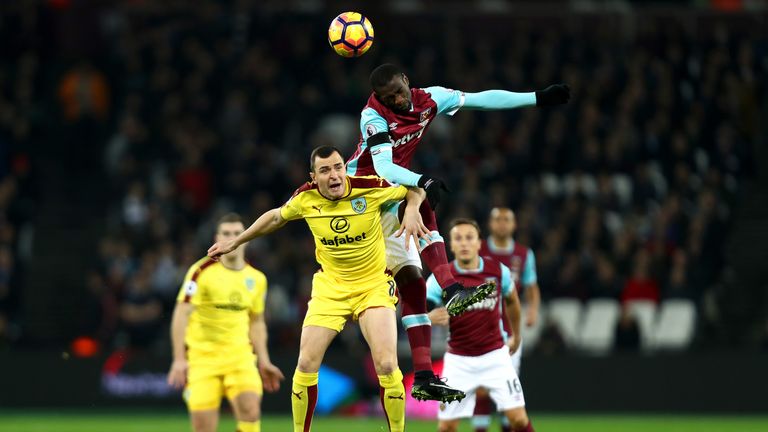 Dean Marney and Pedro Obiang battle to win a header at the London Stadium
