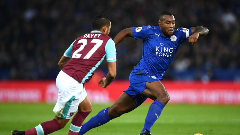 Wes Morgan takes on Dimitri Payet at the King Power Stadium