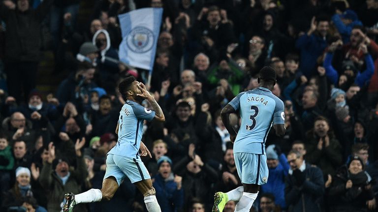 Raheem Sterling celebrates scoring Man City's second goal