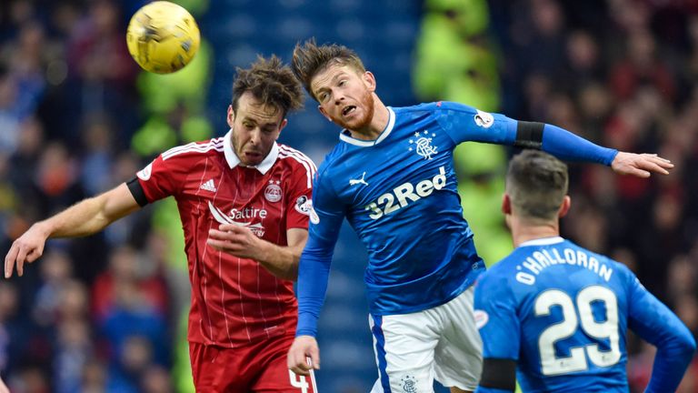 Andrew Considine and Joe Garner compete for a high ball