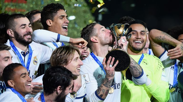 Sergio Ramos kisses the trophy as Real Madrid celebrate winning the FIFA Club World Cup