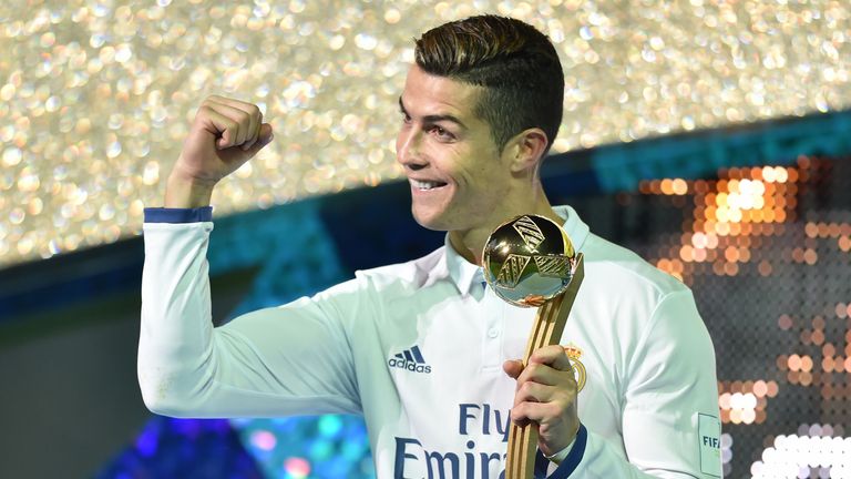 Cristiano Ronaldo receives the Golden Ball trophy after winning the Club World Cup