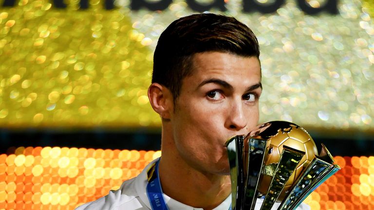 Cristiano Ronaldo kisses the trophy following Real Madrid's victory in the Club World Cup final