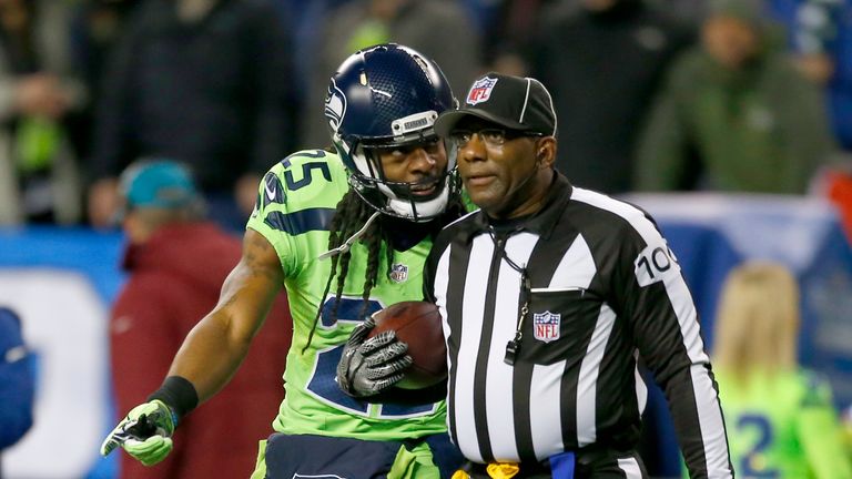SEATTLE, WA - DECEMBER 15:  Cornerback Richard Sherman #25 of the Seattle Seahawks talks with Line Judge Tom Symonette after a play against the Los Angeles