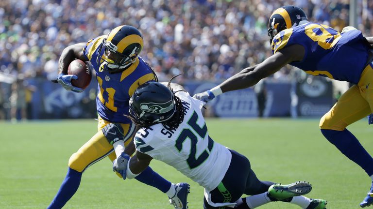 LOS ANGELES, CA - SEPTEMBER 18:  Richard Sherman #25 of the Seattle Seahawks takes down Tavon Austin #11 of the Los Angeles Rams during the second quarter 