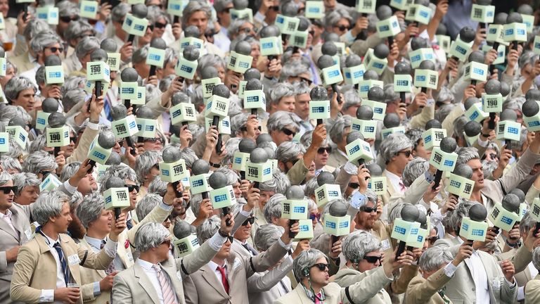 Spectators pay tribute to the late Richie Benaud during day two of the third Test match between Australia and the West Indies