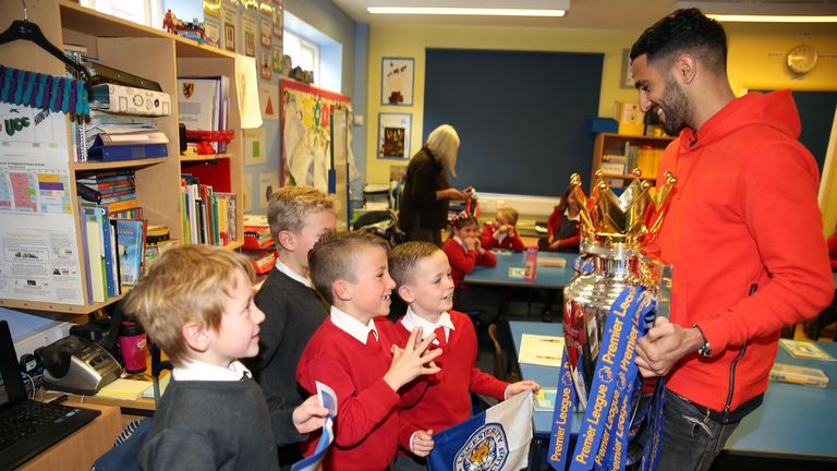 Leicester City's Riyad Mahrez suprises four young fans (L-R) Archie Holm, Liam Letts, Leon Oscar Shakespeare and Alfie Marriott