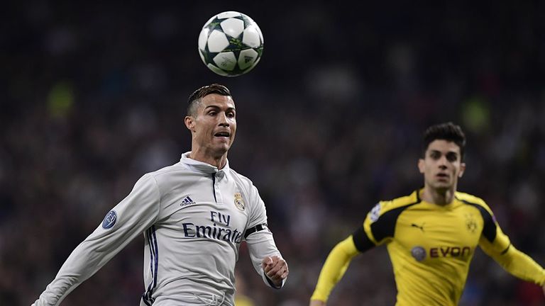 Real Madrid's Portuguese forward Cristiano Ronaldo (L) vies with Dortmund's Spanish defender Marc Bartra