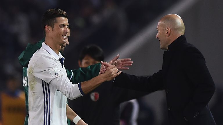 YOKOHAMA, JAPAN - DECEMBER 18:  Cristiano Ronaldo of Real Madrid shakes hands with Real Madrid coach Zinedine Zidane during the FIFA Club World Cup final m