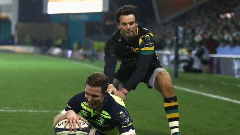 NORTHAMPTON, ENGLAND - DECEMBER 09:  Rory O'Loughlin of Leinster beats Ben Foden to the high ball to score a try during the European Rugby Champions Cup ma