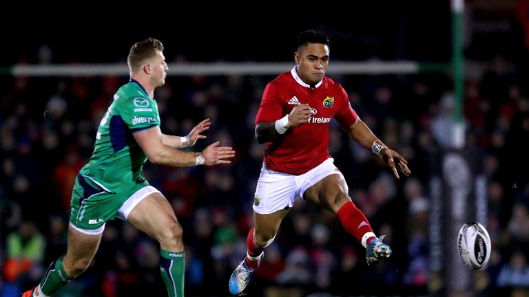 Francis Saili kicks the ball under pressure from Connacht's Peter Robb