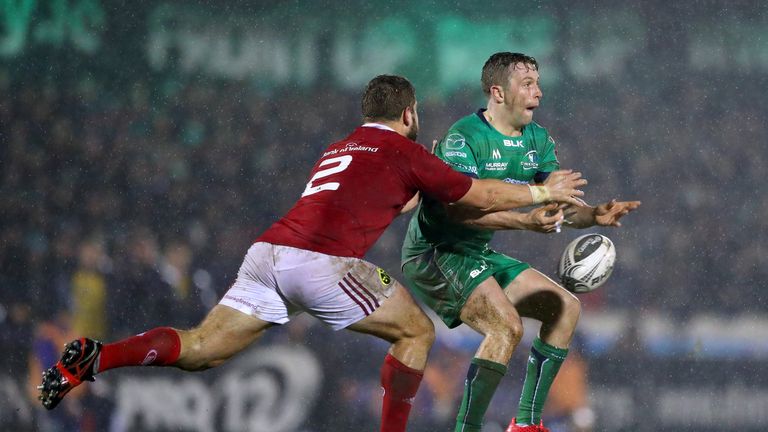 Jack Carty is closed down by Munster's James Cronin