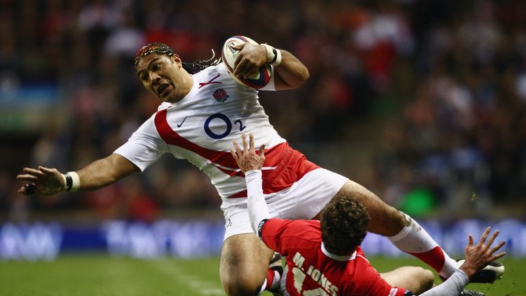 Lesley Vainikolo is tackled by Wales' Mark Jones during his England debut in 2008