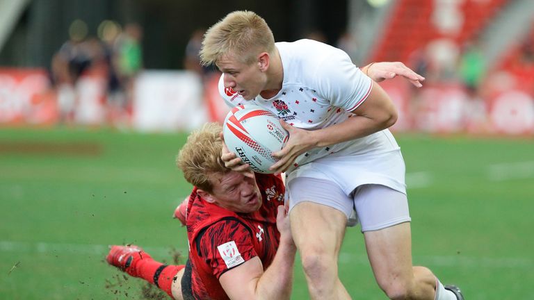 SINGAPORE - APRIL 17: Sam Cross (L) of Wales tries to tackle Cameron Cowell of England during the 2016 Singapore Sevens Bowl Quarter Final between England 