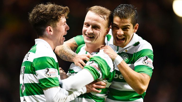 Celtic striker Leigh Griffiths (C) celebrates with Ryan Christie and Cristian Gamboa