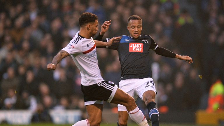 LONDON, ENGLAND - DECEMBER 17: Marcus Olsson of Derby County is tackled by Ryan Fredericks of Fulham  during the Sky Bet Championship match between Fulham 