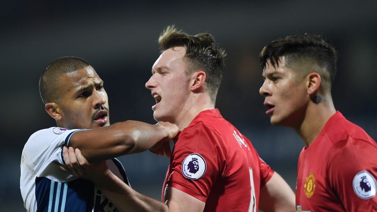 WEST BROMWICH, ENGLAND - DECEMBER 17:  Jose Salomon Rondon of West Bromwich Albion (L) and Phil Jones of Manchester United (C) clash during the Premier Lea