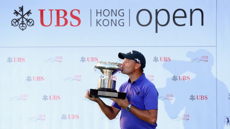 HONG KONG - DECEMBER 11:  Sam Brazel of Australia poses with the trophy after winning the UBS Hong Kong Open at The Hong Kong Golf Club on December 11, 201