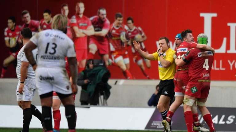 Scarlets players celebrate victory on the final whistle after the European Rugby Champions Cup match between Scarlets and Toulon