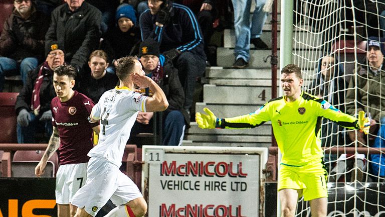 Partick's Sean Welsh runs towards the away fans after the equaliser at Tynecastle