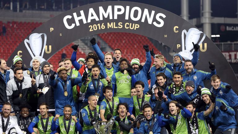 Seattle Sounders celebrate their MLS Cup final victory over Toronto FC at BMO Field on December 10, 2016 in Toronto. / AFP / Cole Burston        (Photo cre