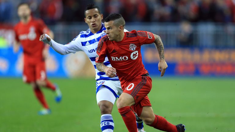 TORONTO, ON - MAY 07:  Sebastian Giovinco #10 of Toronto FC dribbles the ball as Michael Barrios #21 of FC Dallas defends during the first half of an MLS s
