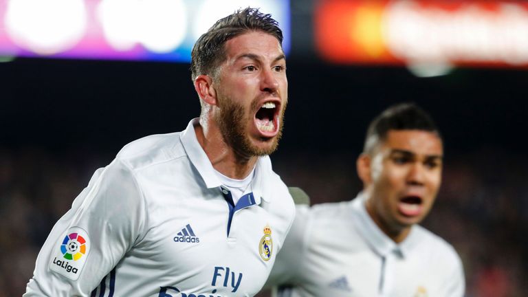 Real Madrid's defender Sergio Ramos celebrates after scoring the equalizer during the Spanish league football match FC Barcelona vs Real Madrid CF at the C
