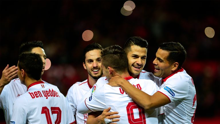 Sevilla's Argentinian forward Luciano Vietto (3R) celebrates a goal with teammates during the Spanish league football match Sevilla FC vs Malaga CF at the 