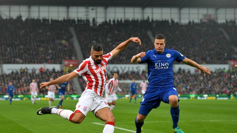 Jonathan Walters of Stoke (left) attempts to cross undr pressure from Leicester's Robert Huth 