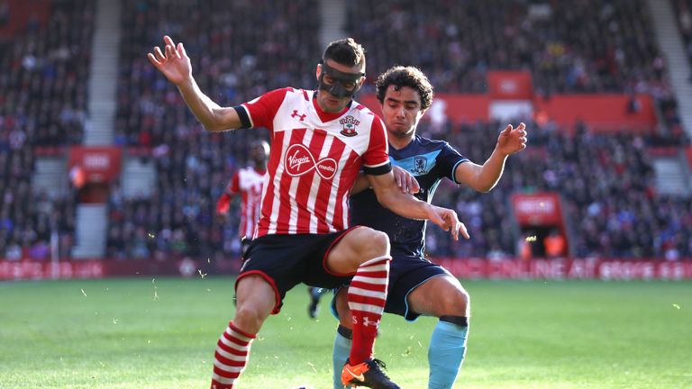 SOUTHAMPTON, ENGLAND - DECEMBER 11: Dusan Tadic of Southampton and Fabio Da Silva of Middlesbrough battle for possession during the Premier League match be