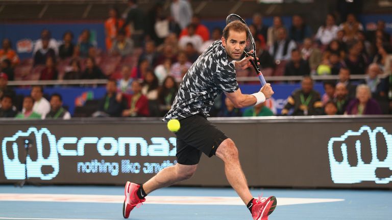 Pete Sampras of the Indian Aces plays a backhand against Patrick Rafter of the Singapore Slammers