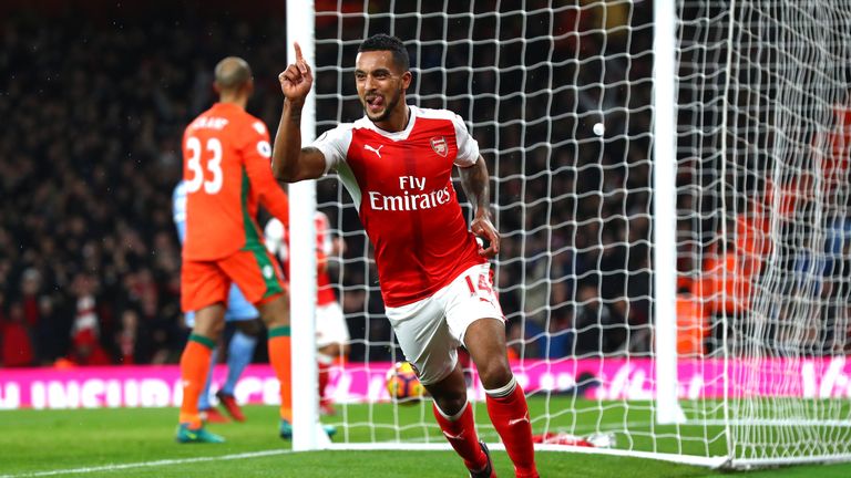 LONDON, ENGLAND - DECEMBER 10:  Theo Walcott of Arsenal celebrates scoring his sides first goal during the Premier League match between Arsenal and Stoke C