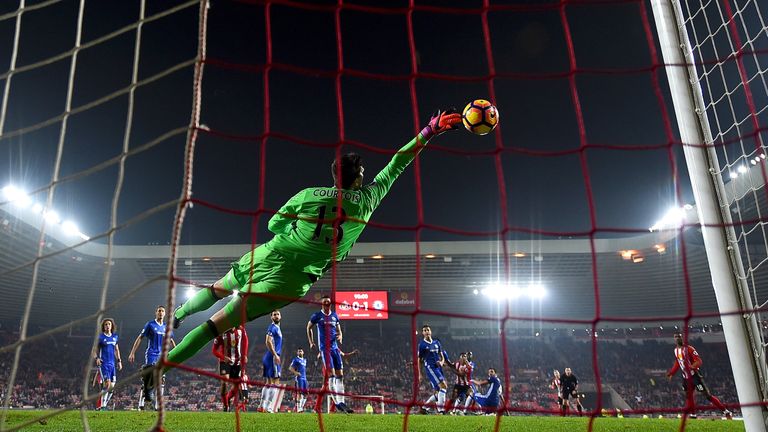 Thibaut Courtois saves from Patrick van Aanholt