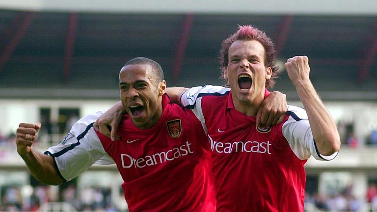 LONDON, UNITED KINGDOM:  Arsenal's French striker Thierry Henry (L) celebrates the goal scored by teammate Frederik Ljungberg at Arsenal's football ground 
