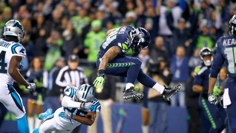 SEATTLE, WA - DECEMBER 04:  Running back Thomas Rawls #34 of the Seattle Seahawks leaps into the endzone for a touchdown against the Carolina Panthers at C